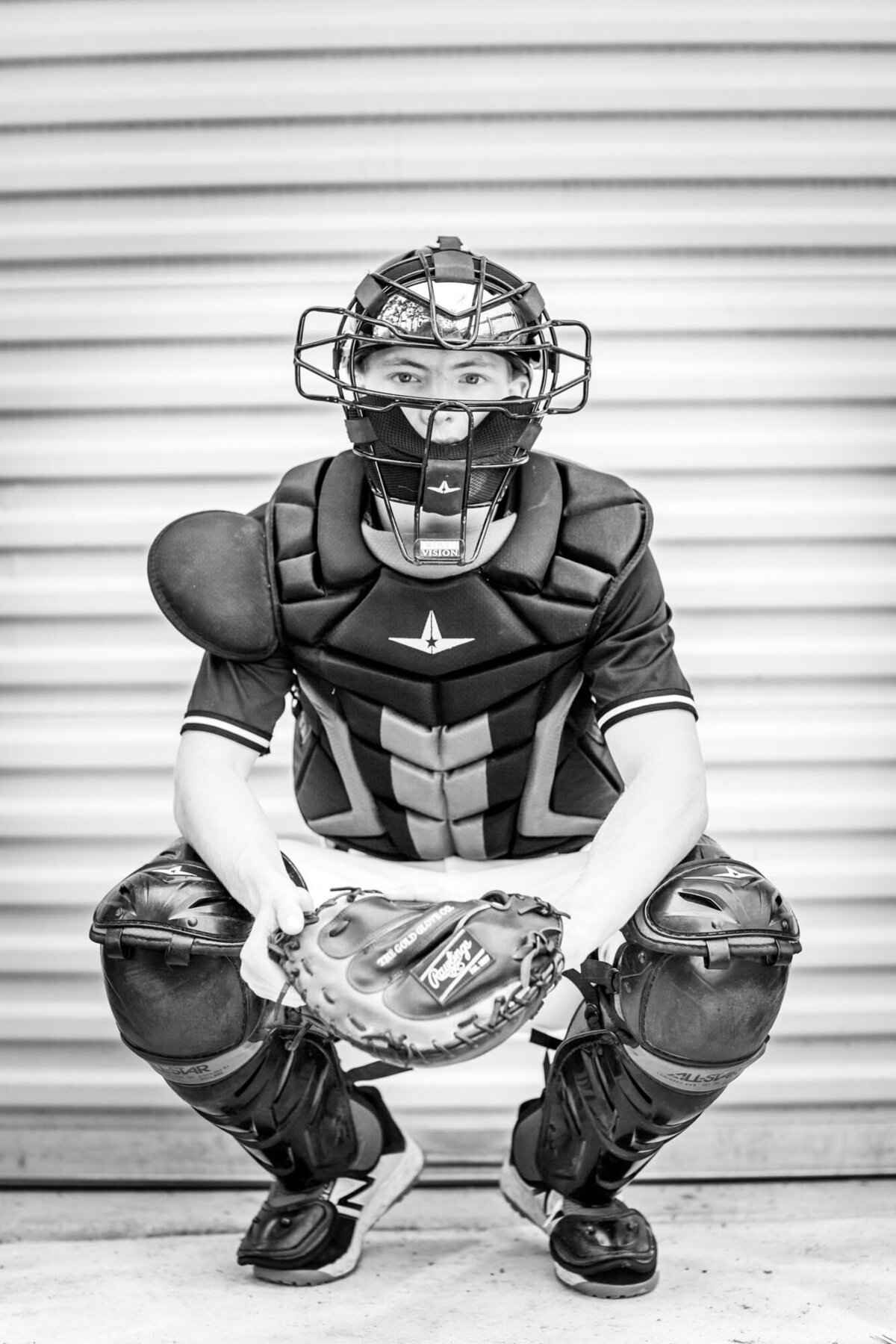 This senior was a catcher since he was little so we got this dramatic black and white portrait in his gear.