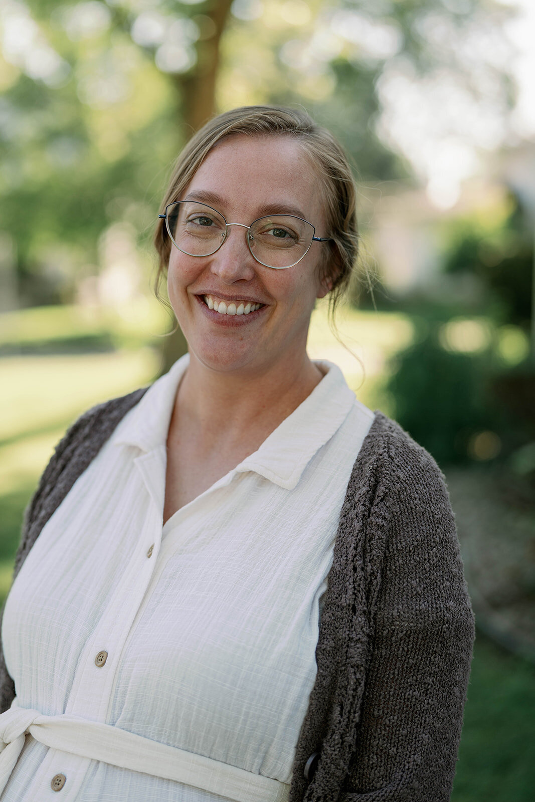 Smiling portrait of the planner company owner standing outdoors during her Indiana branding session.