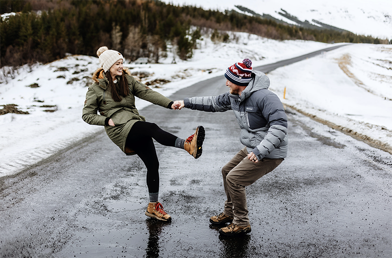 married couple is having fun in the snow in Iceland