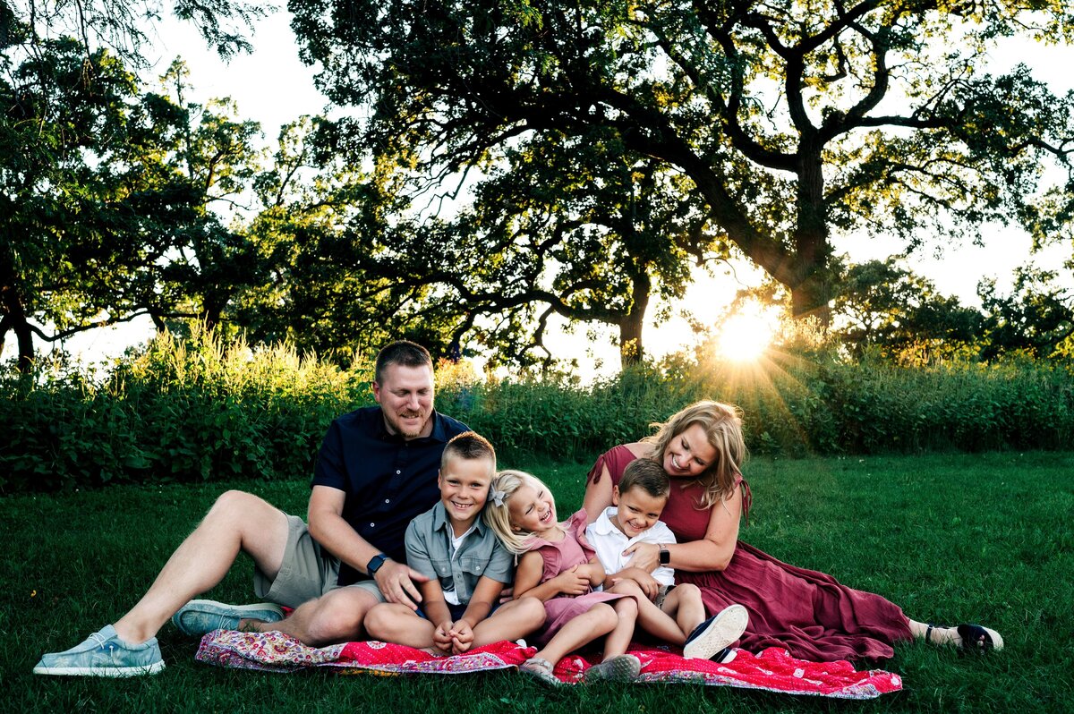 Family cuddling summer sunshine McKennaPattersonPhotography