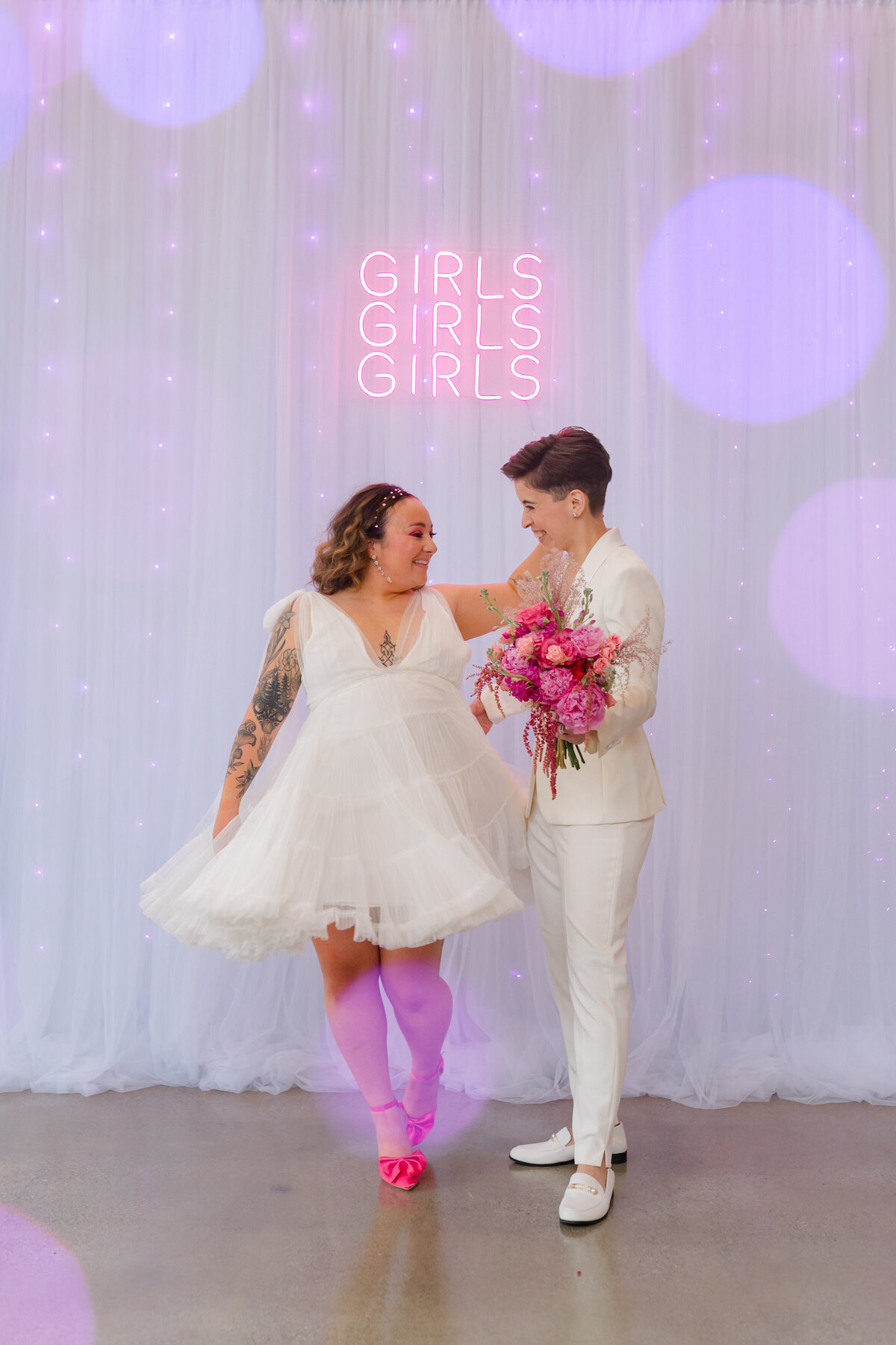 Bride twirling in her short wedding dress