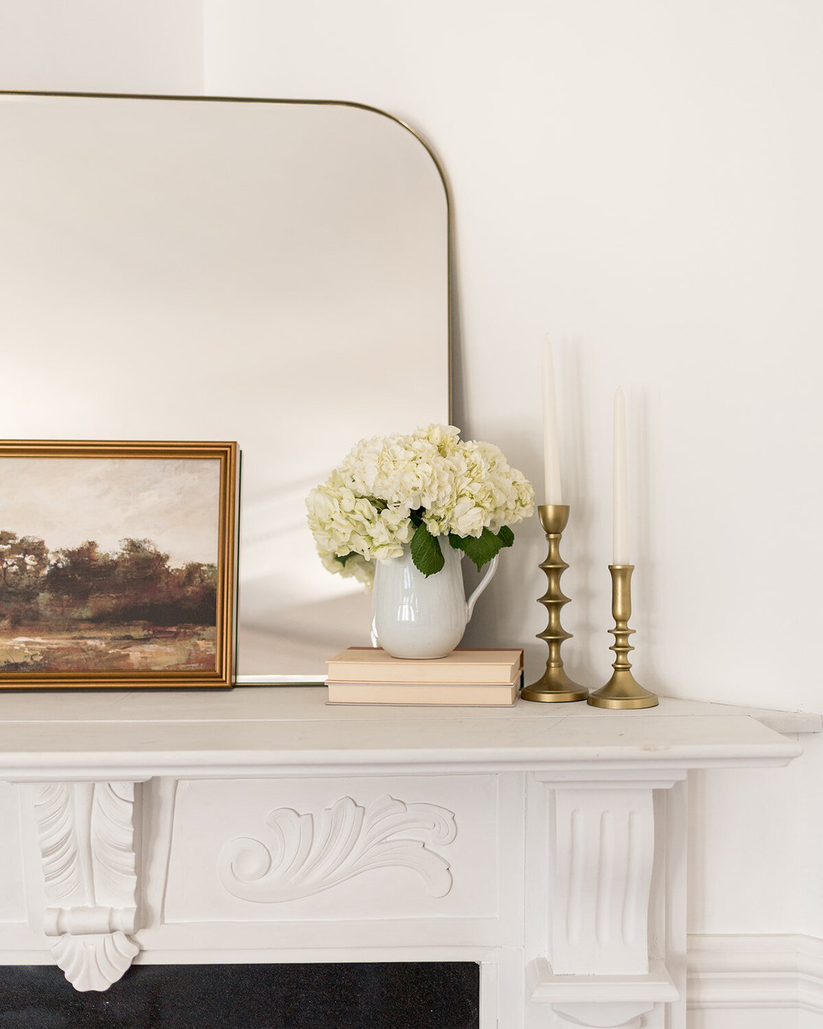 melinda chesson interiors boston arched mirror and gold candle sticks