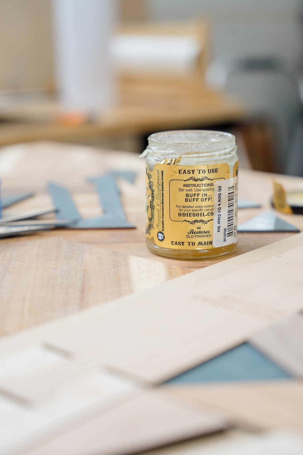 detail photo of wood working oils sitting on a desk in a workshop