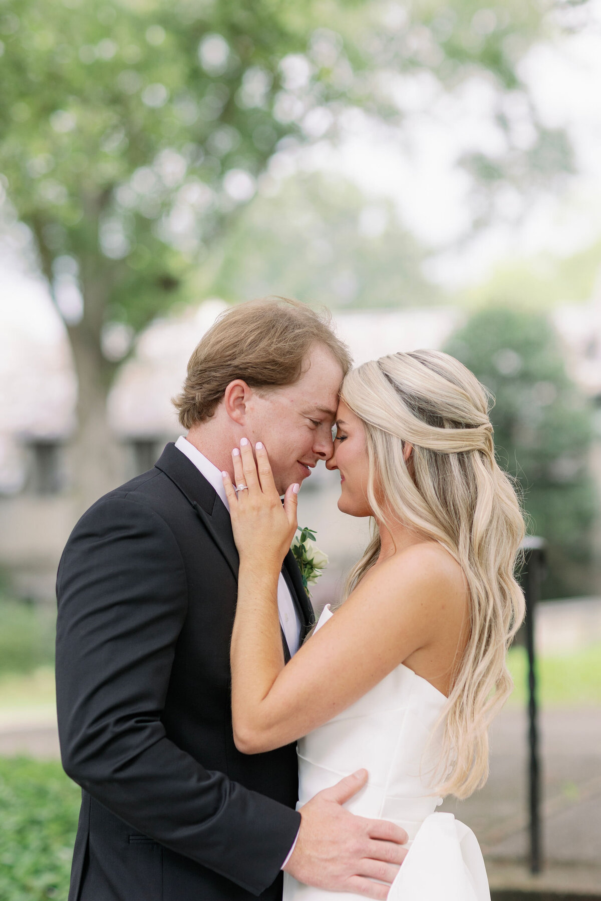 Bride and groom smiling at each other