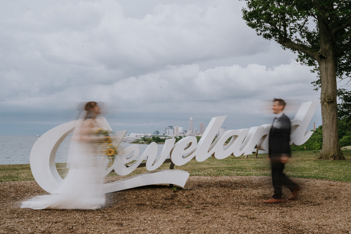 Bride and groom at Cleveland sign