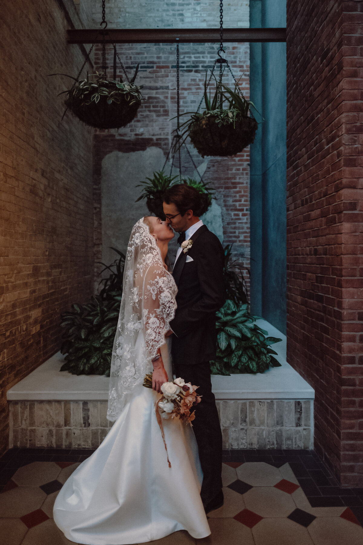 wedding couple kissing at their wedding at Hotel Emma in San Antonio Texas