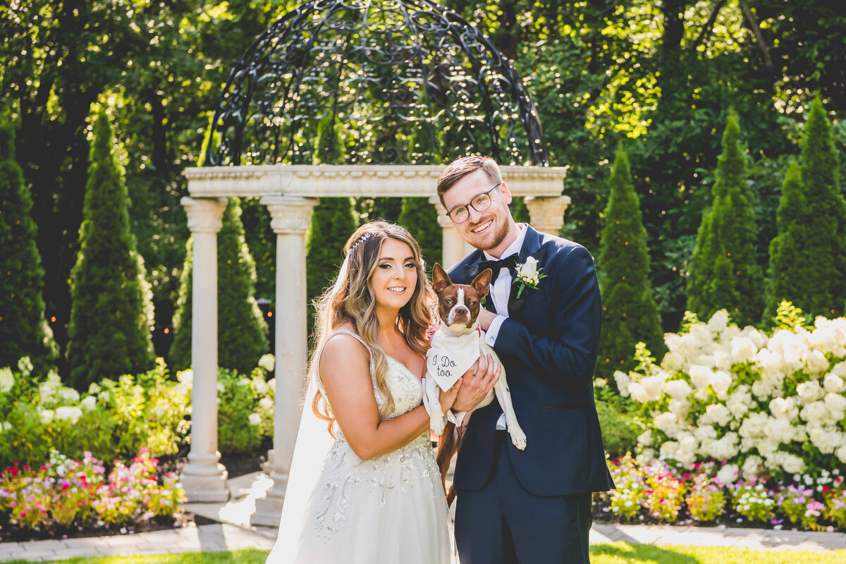 Bride and groom with dog outside at the Hamilton Manor in New Jersey