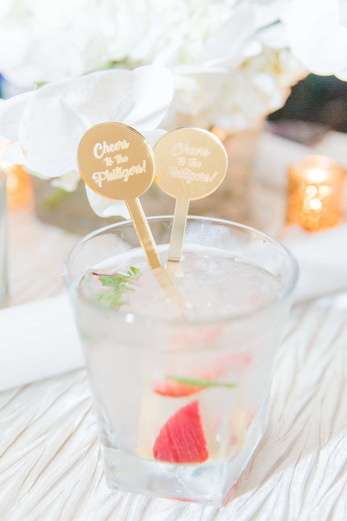 wedding cocktail with gold custom drink stirrers