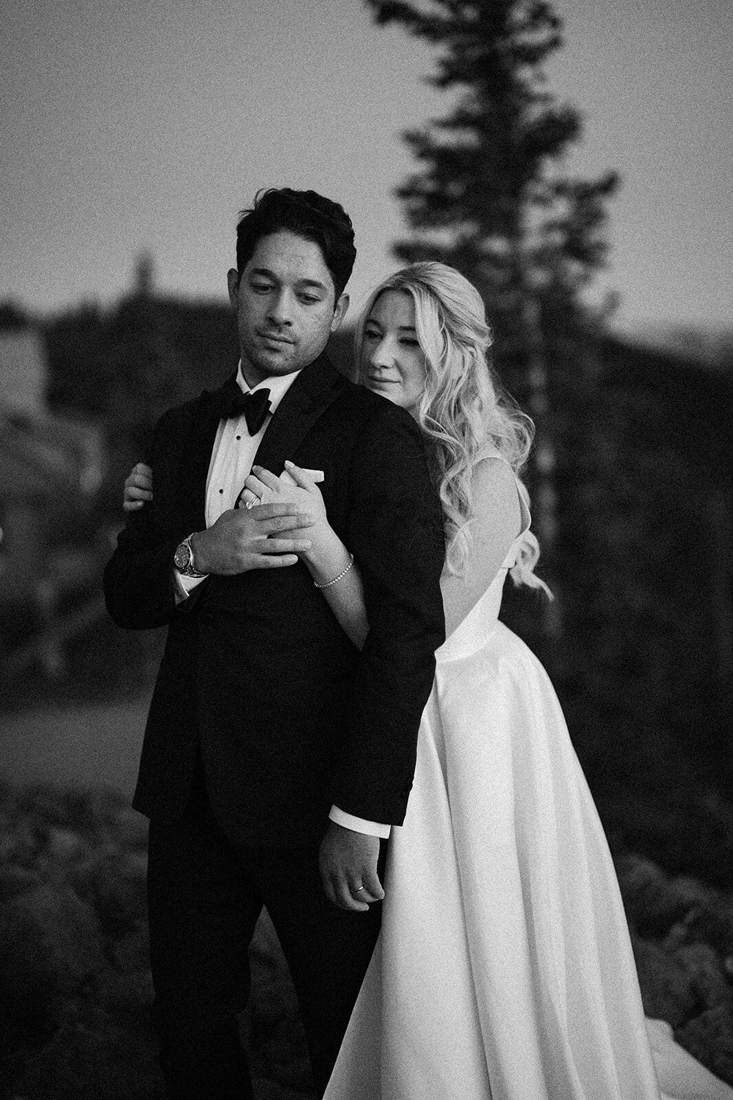 newlyweds-holding-hands-black-and-white-photo-aspen-HBICWeddings
