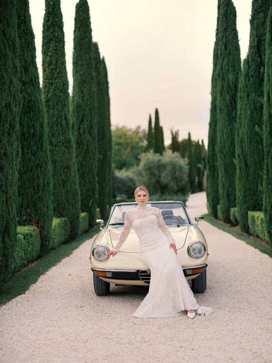 Couple portraits in front of antic Alpha Romeo at  Borgo Santo Pietro 