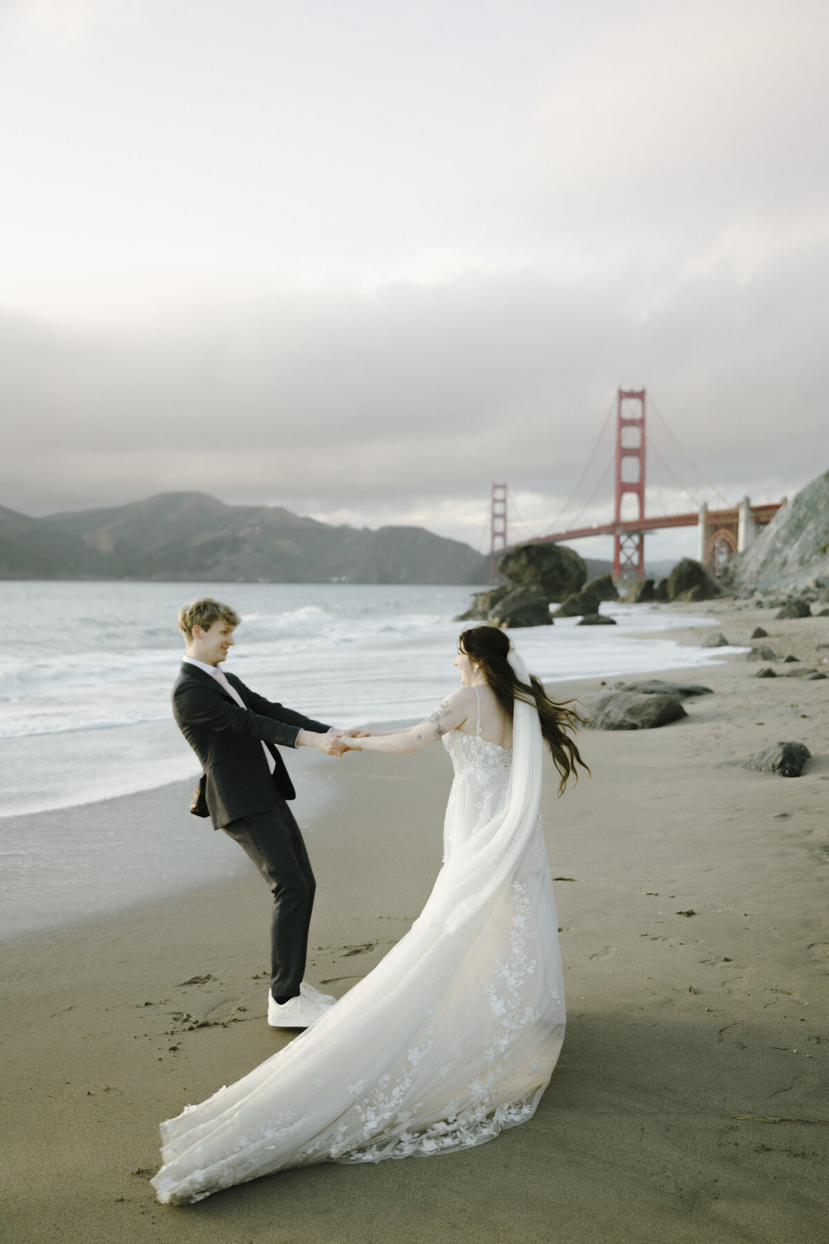 Bride and Groom at Marshall's Beach in San Francisco, California at sunset
