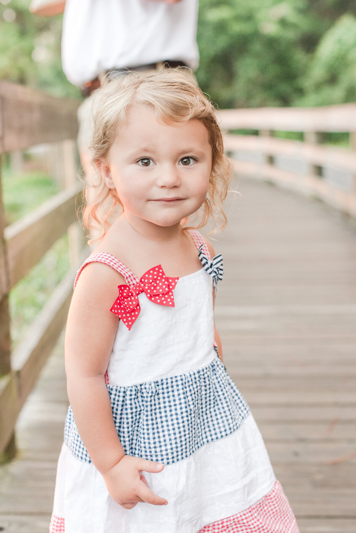 close up of girl in red white and blue dress