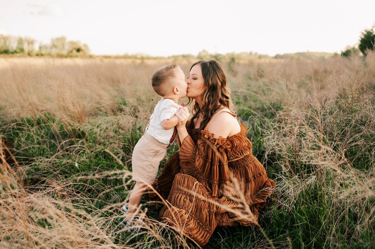 baby boy kissing mom in Branson Mo family photography
