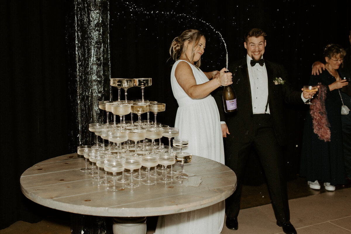 Champagne tower with bride and groom by Richmond Virginia wedding photographer