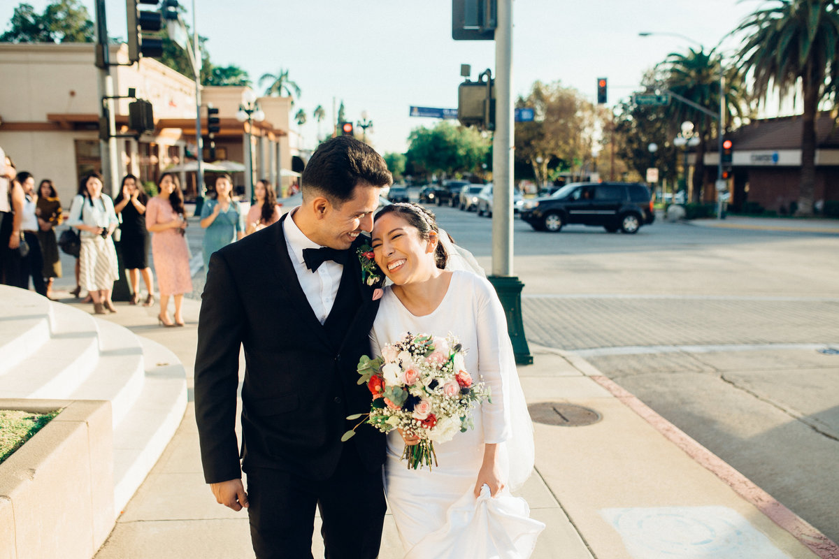 Wedding Photography Of Couple On Sidewalk