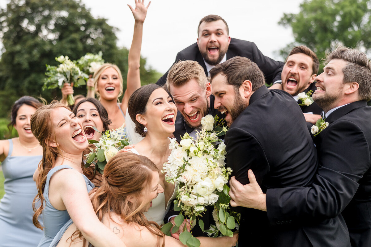 Bride and Groom celebrate with their bridal party at the Chevy Chase Country Club in Wheeling, Illinois.