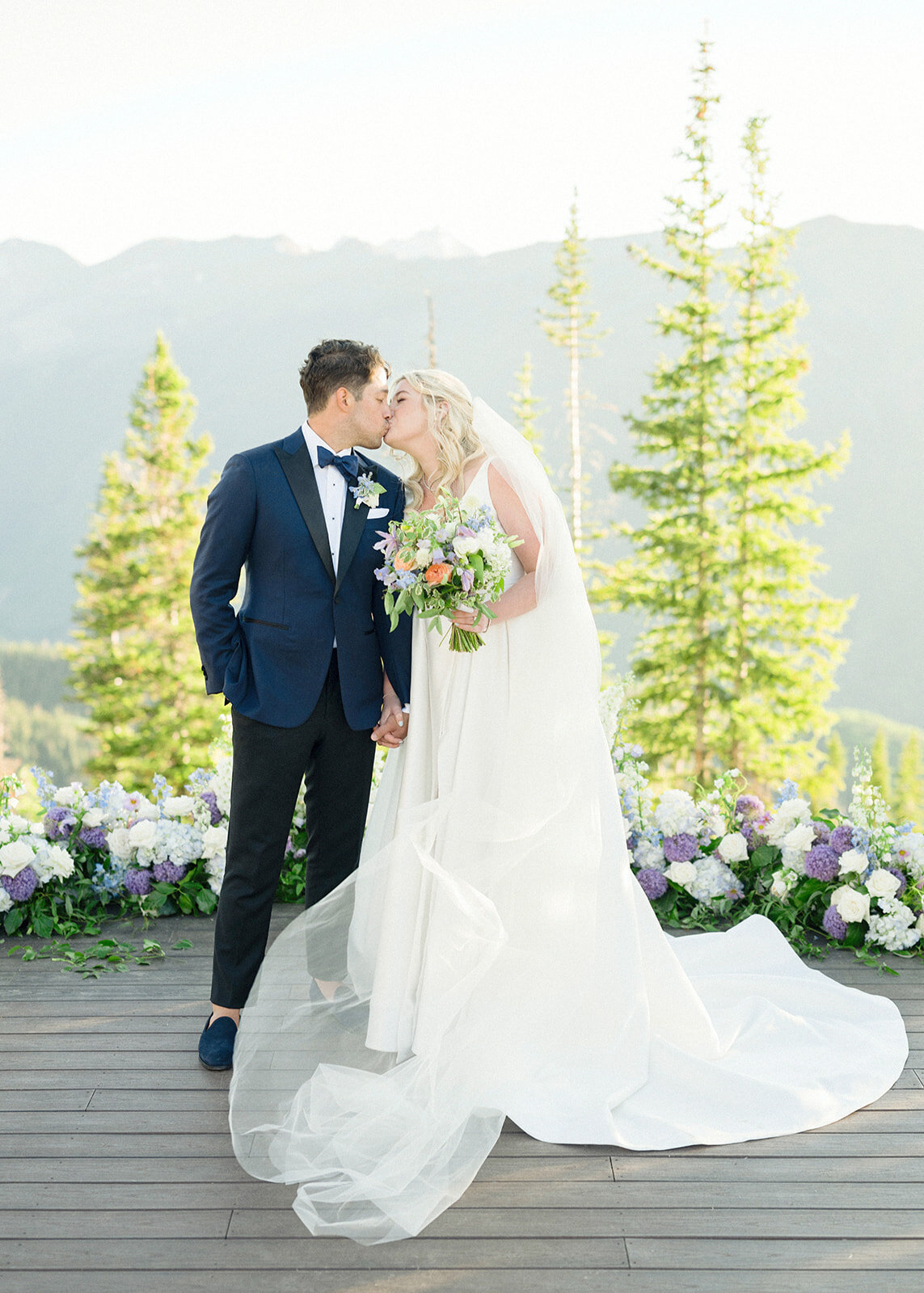 newlyweds-on-deck-kiss-aspen-HBICWeddings