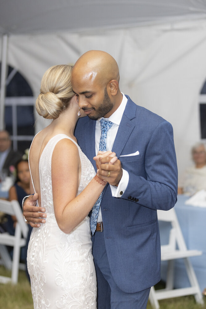 portrait of bride and groom sharing their first dance - gold shoes and wedding details - branford house wedding