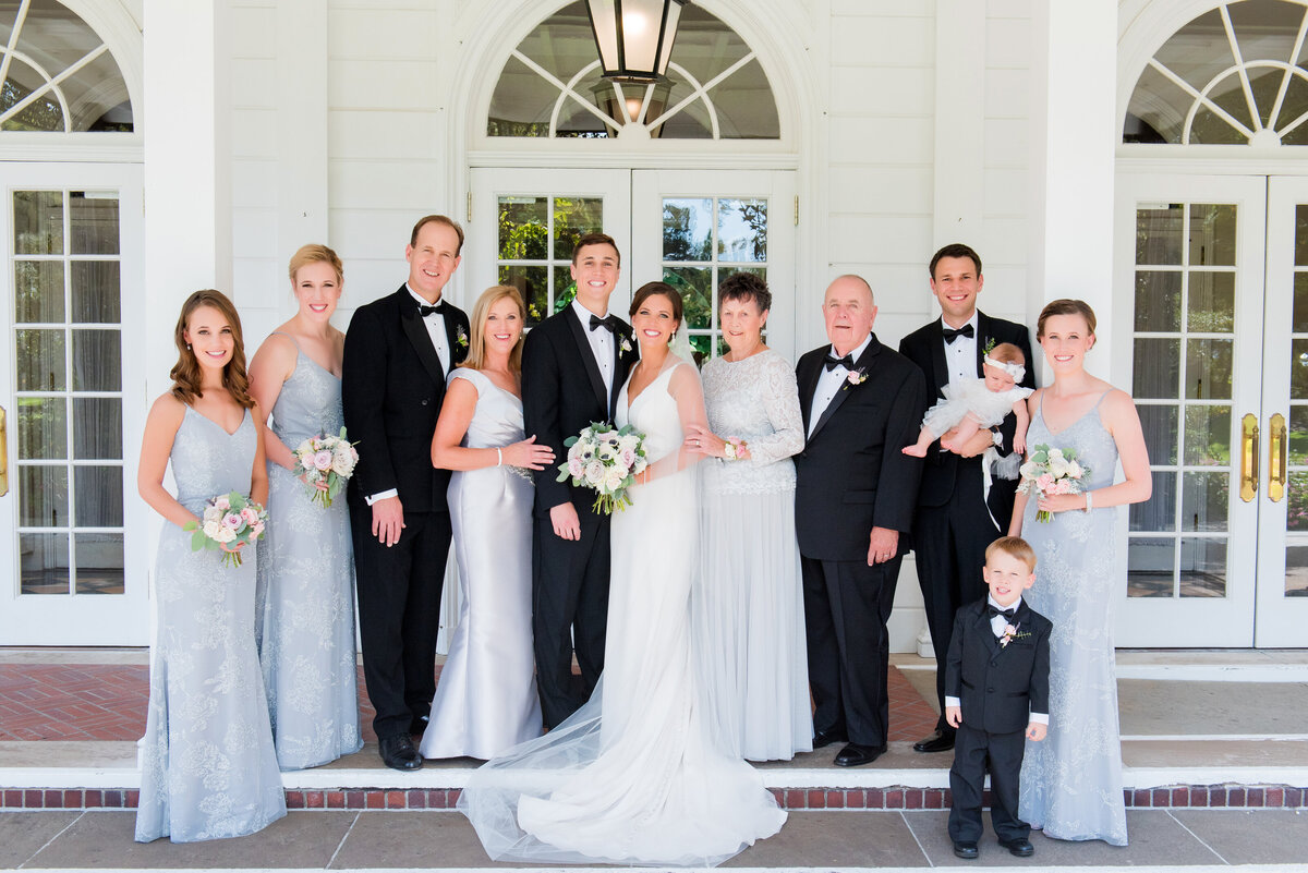 traditional wedding family photos in the valet area in front of fhe fox chapel golf club