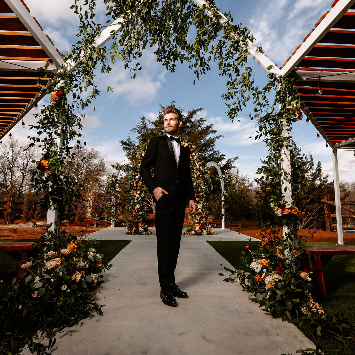 Groom in front of the arches before his wedding
