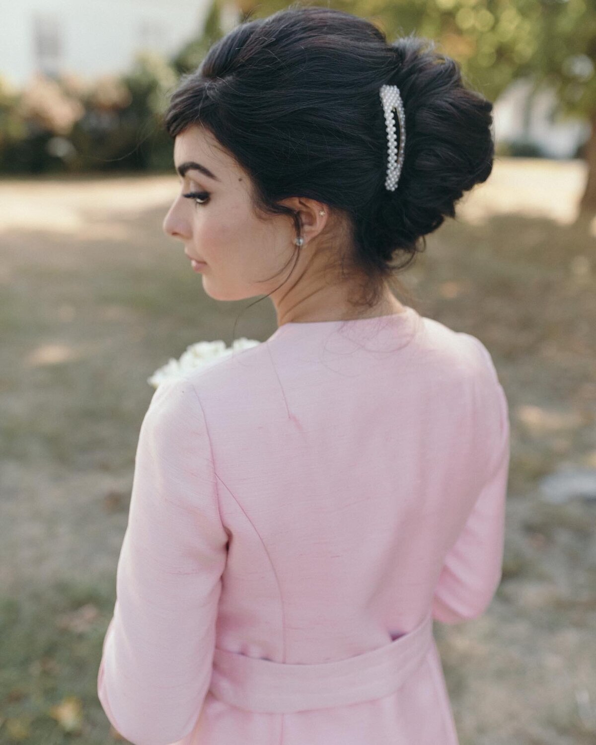erica-renee-beauty-audrey-hepburn-inspired-pearl-clip-french-twist-pink-suit-elopement-CT-NY-NYC-hair-makeup-editorial-brunette-bride-courthouse-wedding-beauty