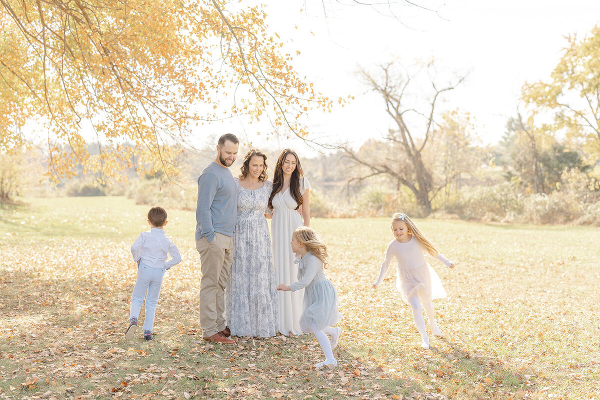 kids running around their parents during Northern Virginia fall mini session
