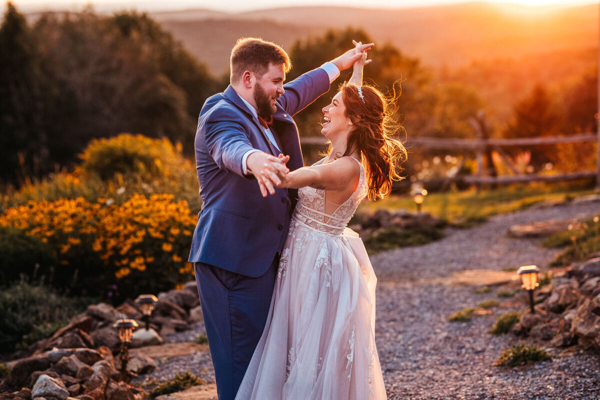Bride and groom having fun in beautiful sunset photos at Cobb Hill Estate by NH wedding photographer Lisa Smith