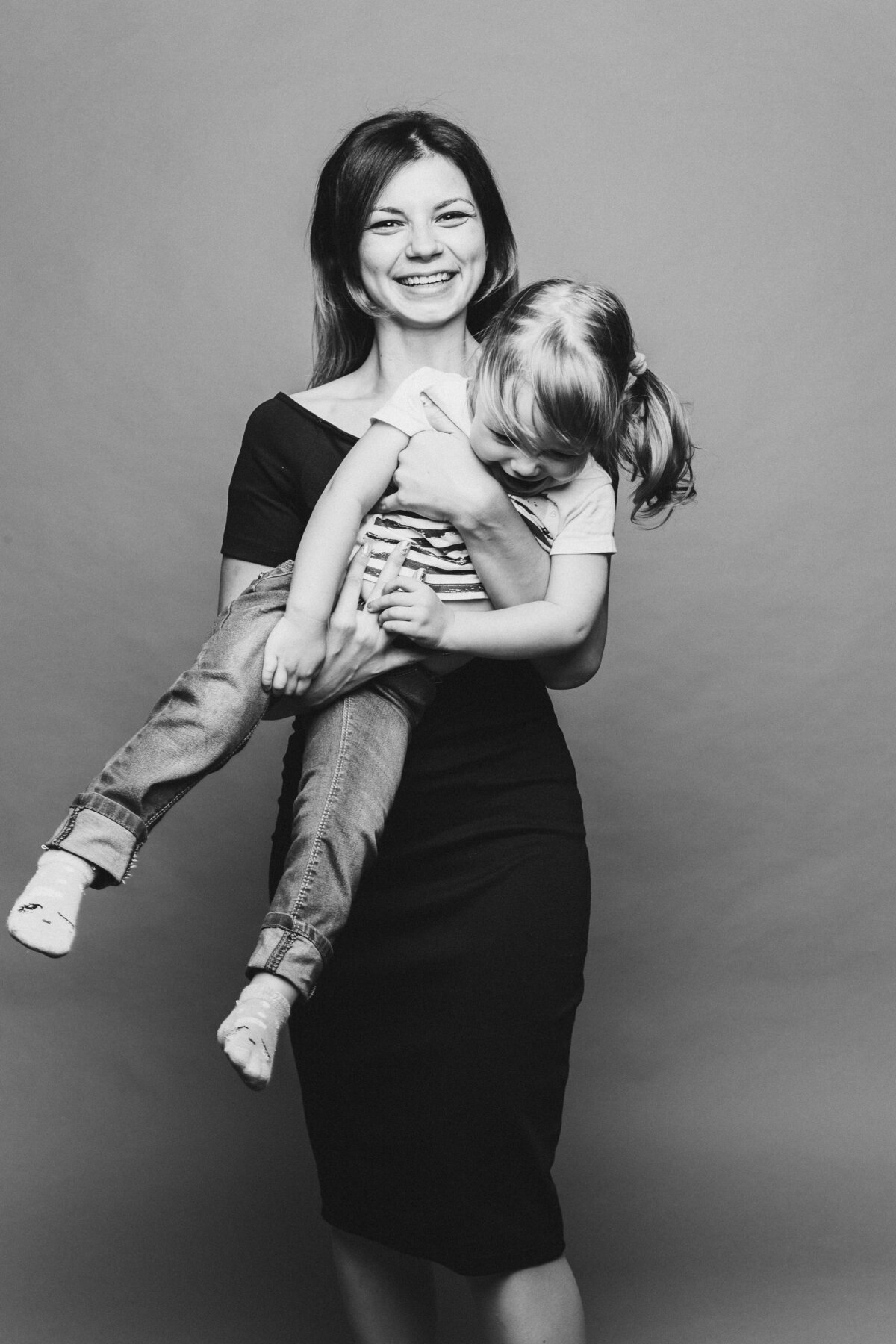 beautiful-young-mom-with-little-child-holding-anf-posing-looking-camera-pretty-stylish-mother-loving-embracing-her-little-son-concept-parent-s-day-family-look-relationship