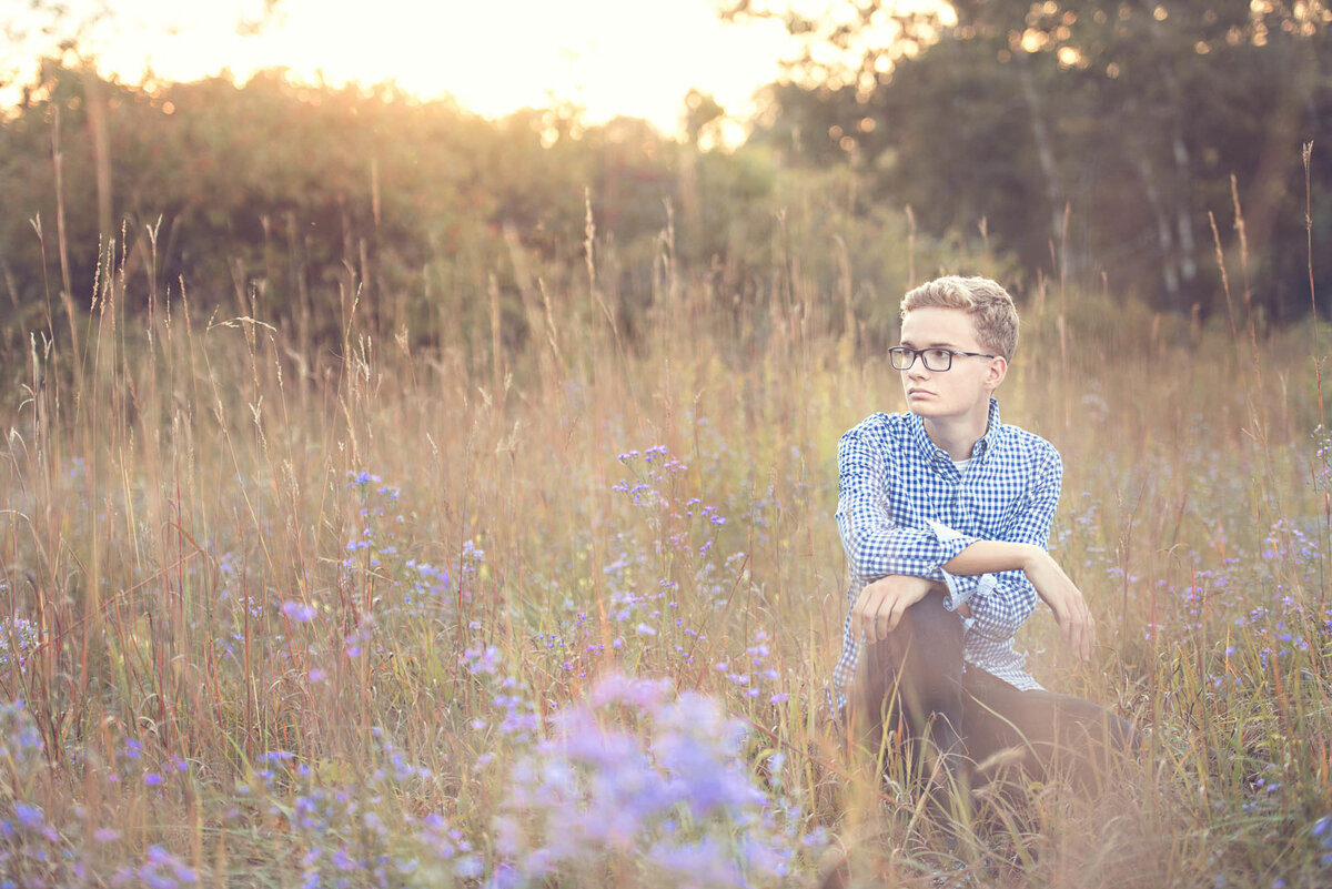 Boy in field senior picture photographer