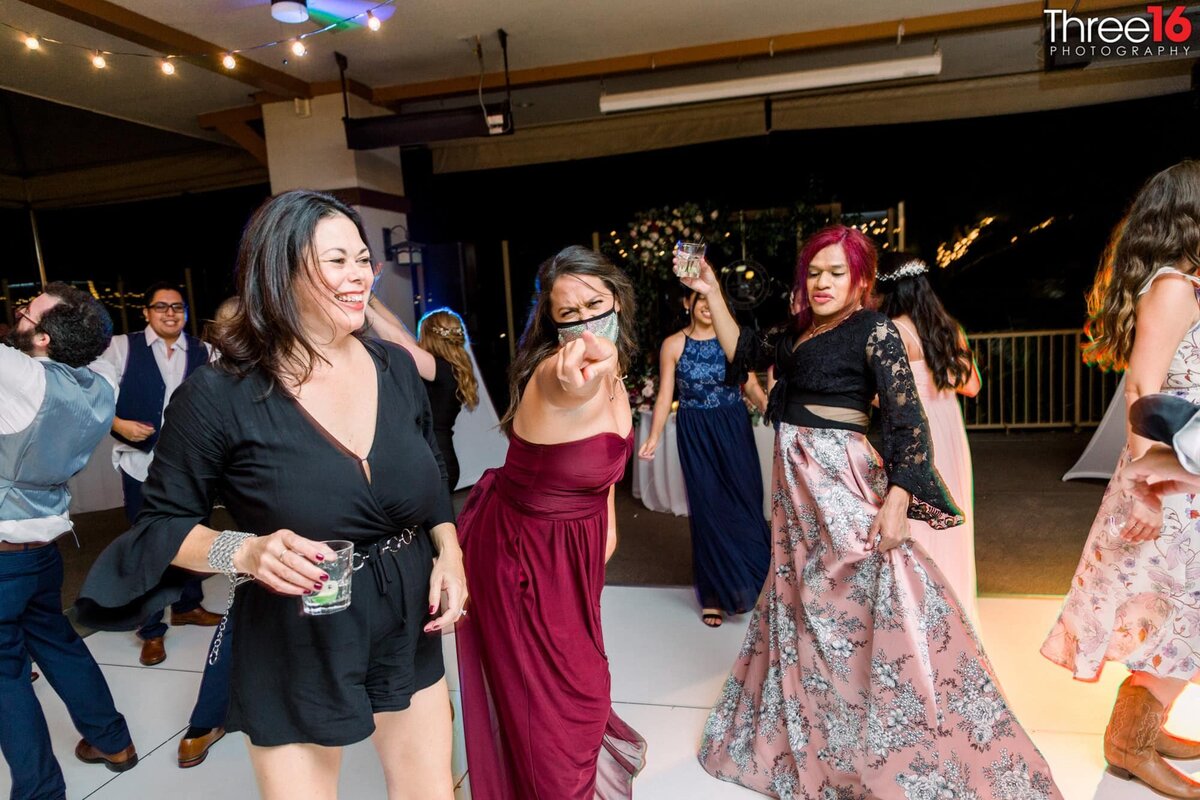 Wedding guests dances to great music during wedding receptin