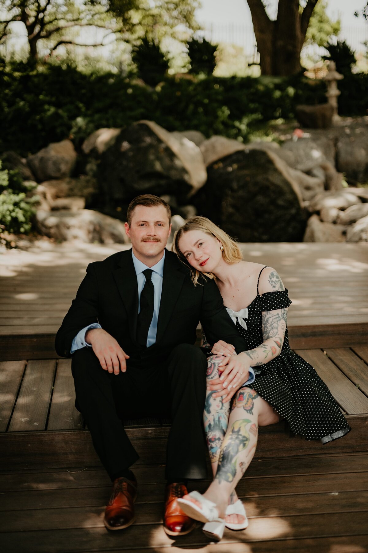 couple sitting at amarillo botanical gardens