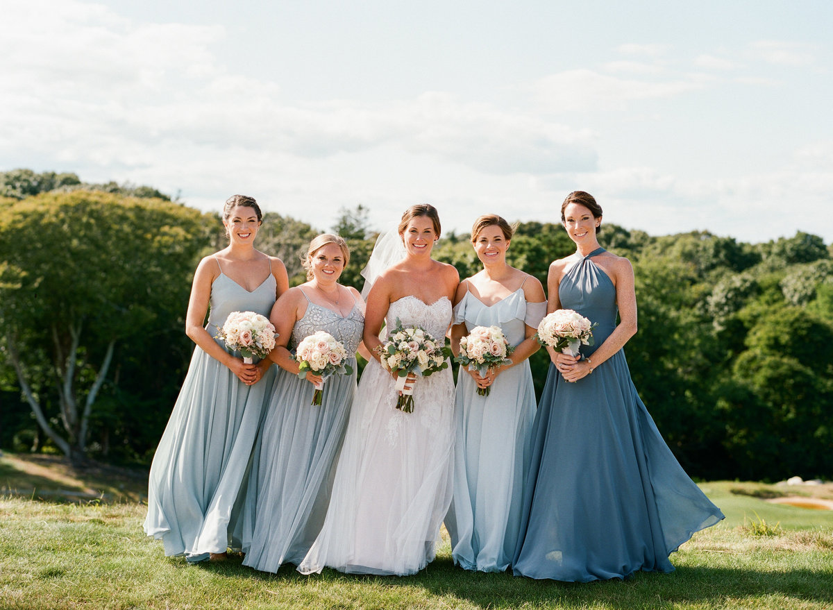 Bridal party blue dresses blush flowers