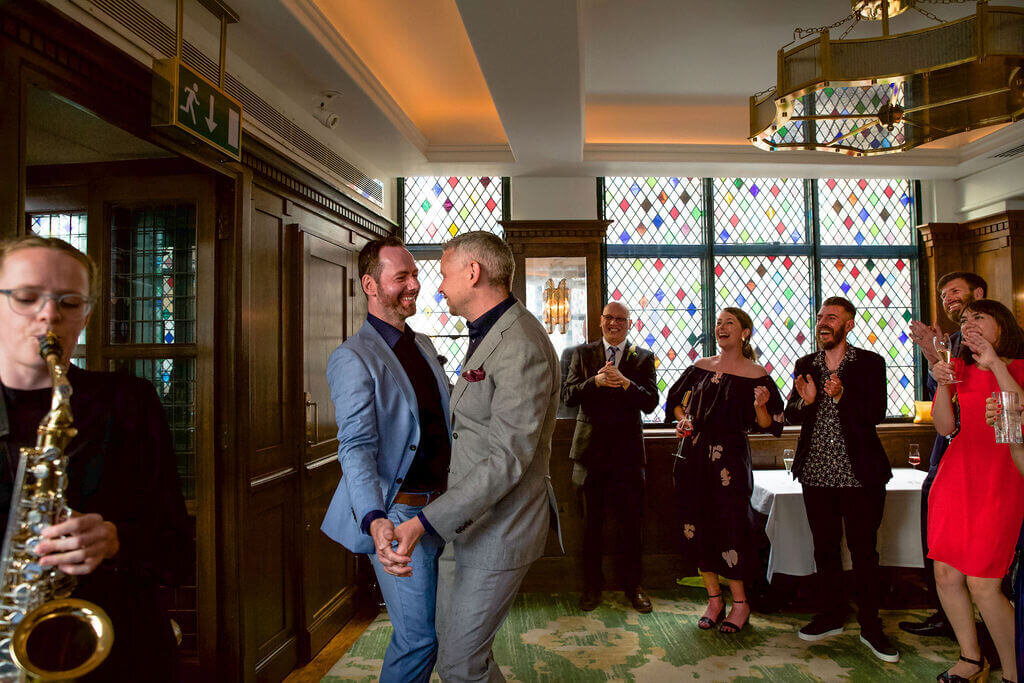 Gay wedding reception at They Ivy.  Grooms first dance
