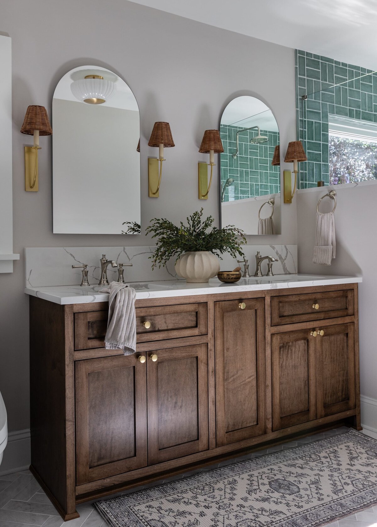 melinda chesson interiors murrayhill road bathroom with arched mirrors and wood cabiet vaneity