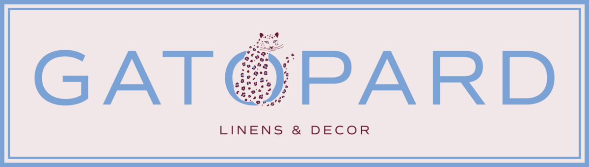 Gatopard Linens & Decor rectangular logo featuring blue border, blushh fill and leopard sitting within the "O"