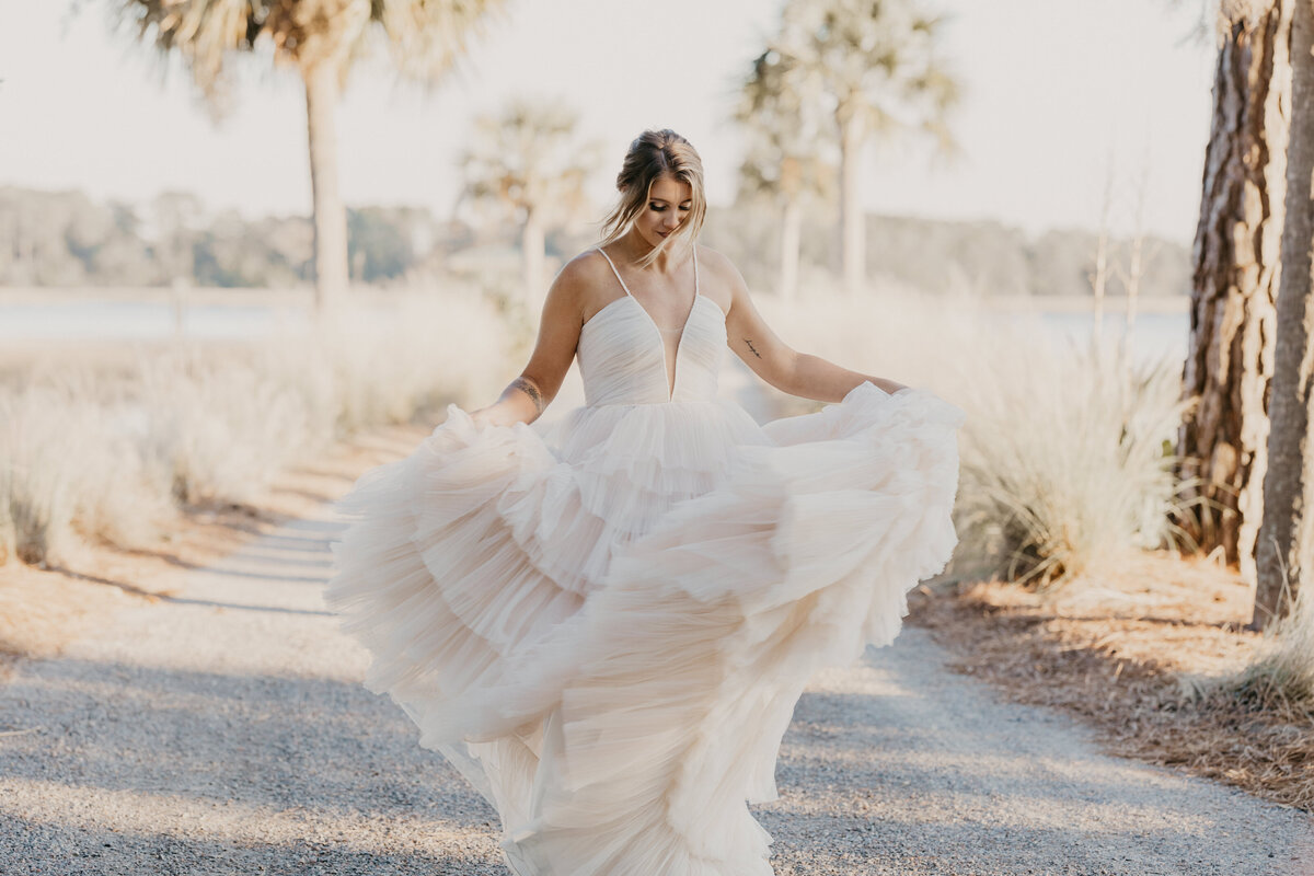 Atlanta bride walks in wedding dress.