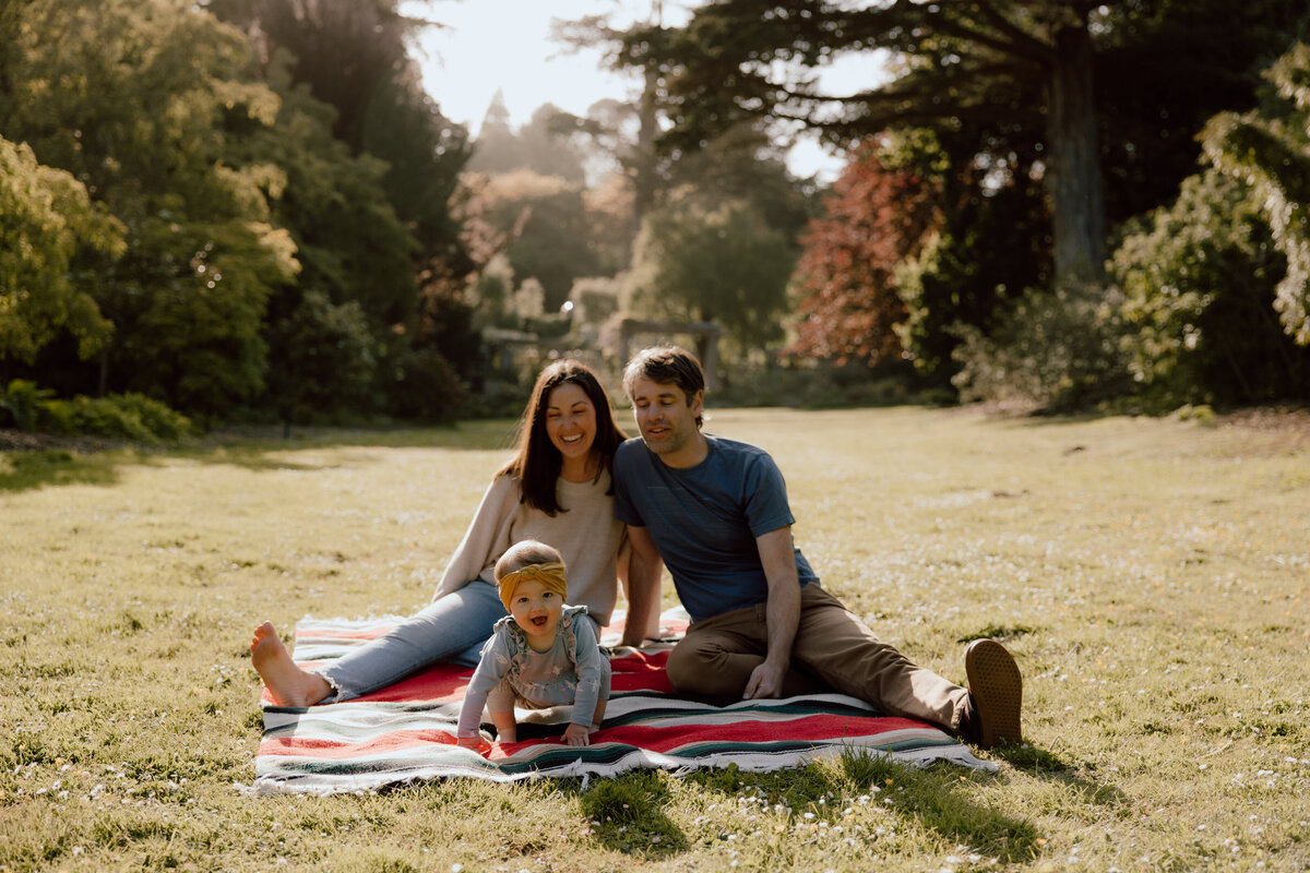 Baby crawling on blanket during family photoshoot at SF Botanical Gardens