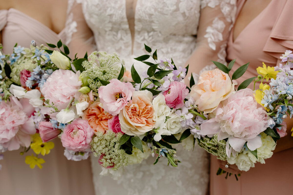 Colorful bouquets designed by Abby Grace Florals at NC wedding