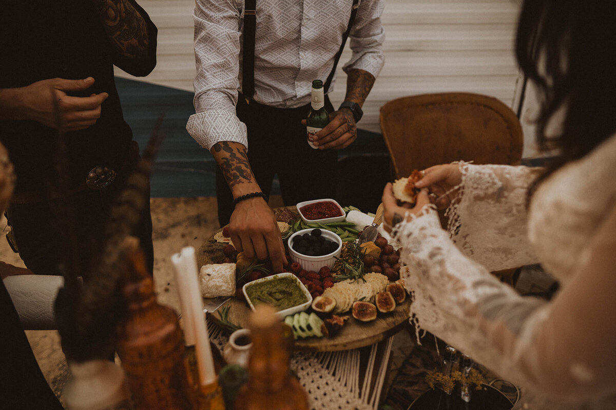 idaho elopement gallery guests enjoy a charcuterie board during the snake river elopement reception
