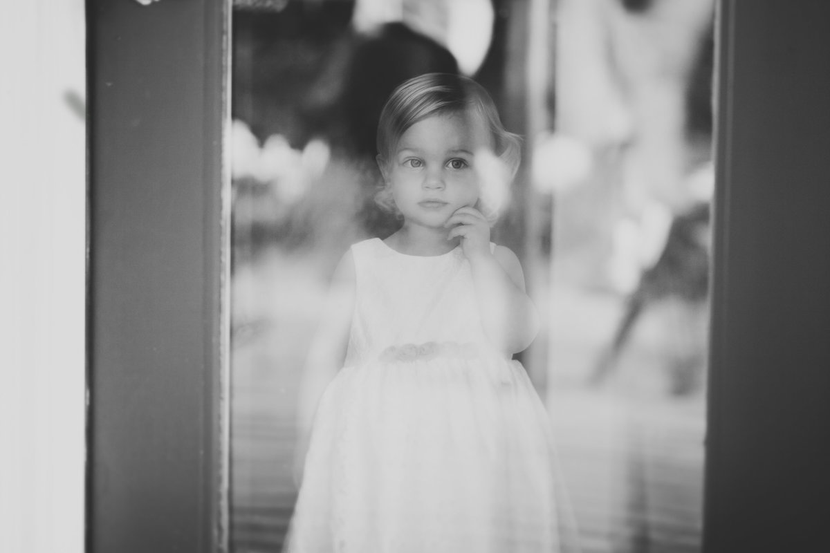 black and white photo of flower girl at wedding  | Susie Moreno Photography