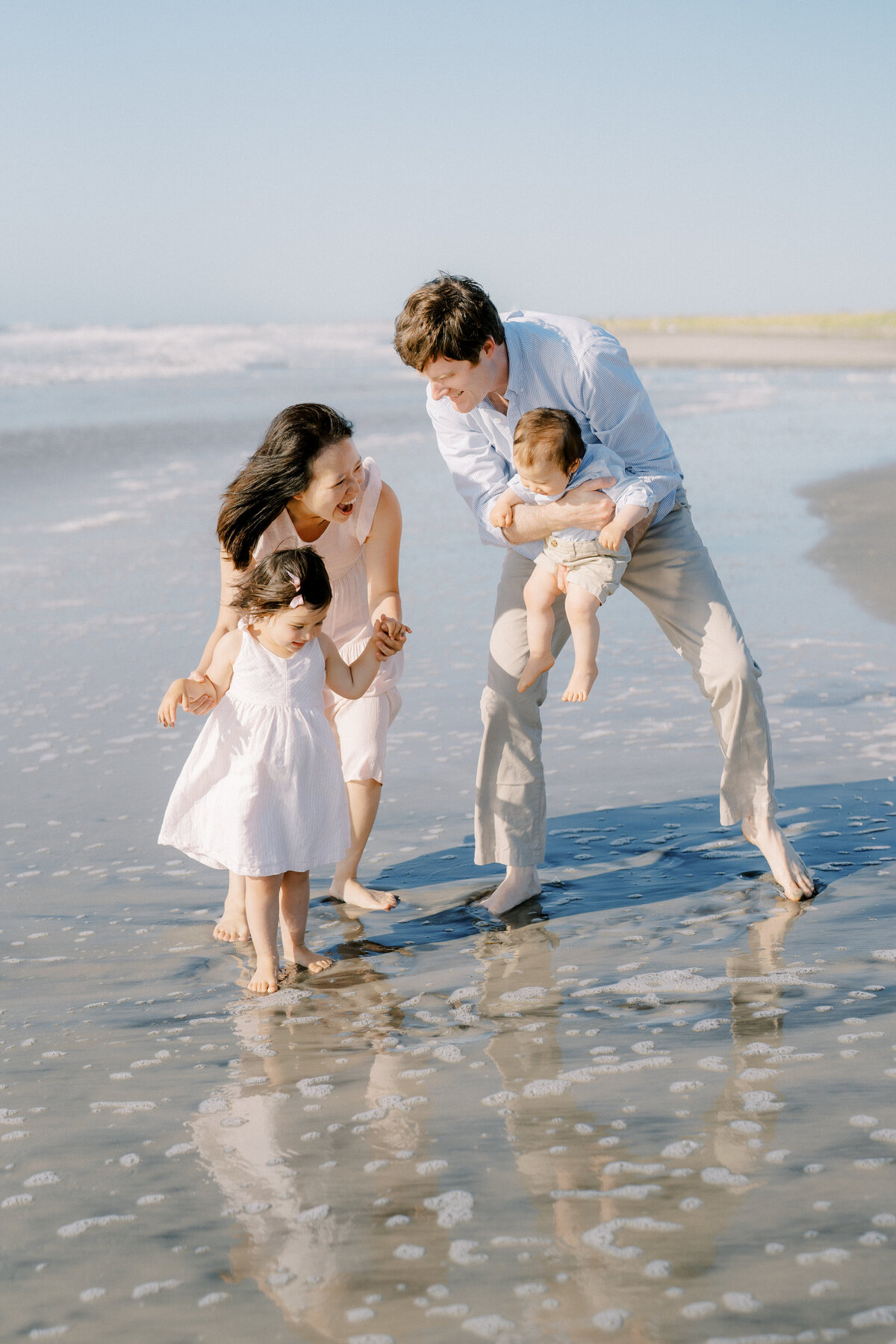 Family playing on the beach in Avalon, NJ