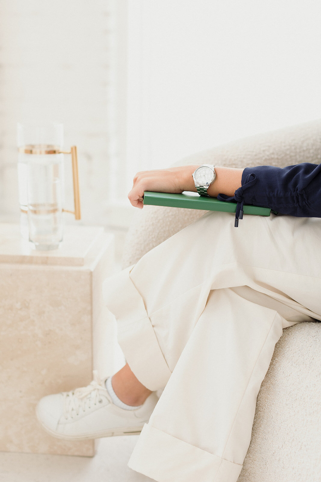 woman sitting with journal and watch