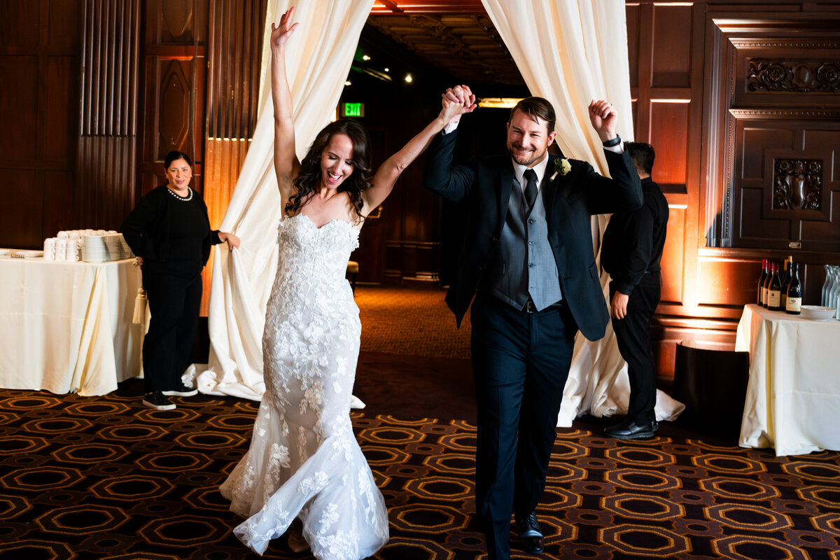 a bride and groom's grand entrance at a Julia Morgan Ballroom Wedding photographed by Duy Ho