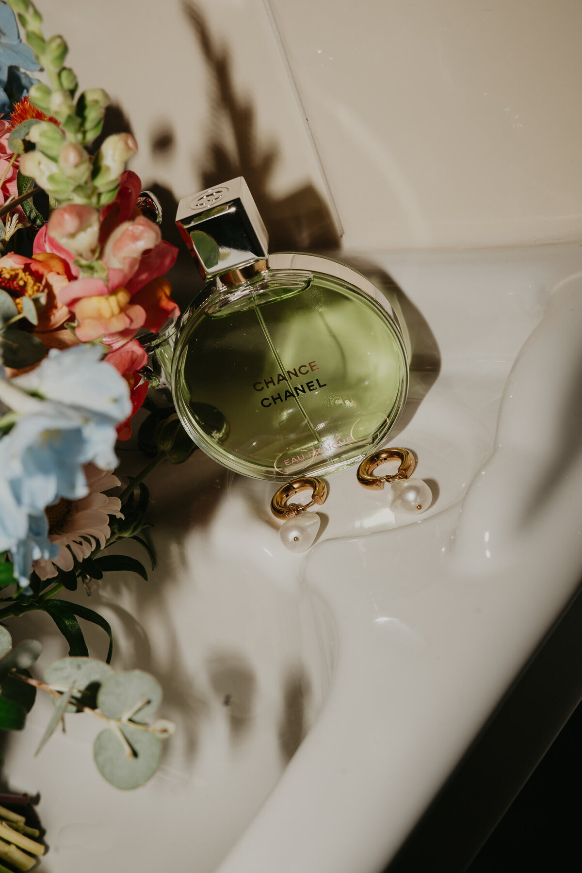 Brides Chanel perfume on a sink.