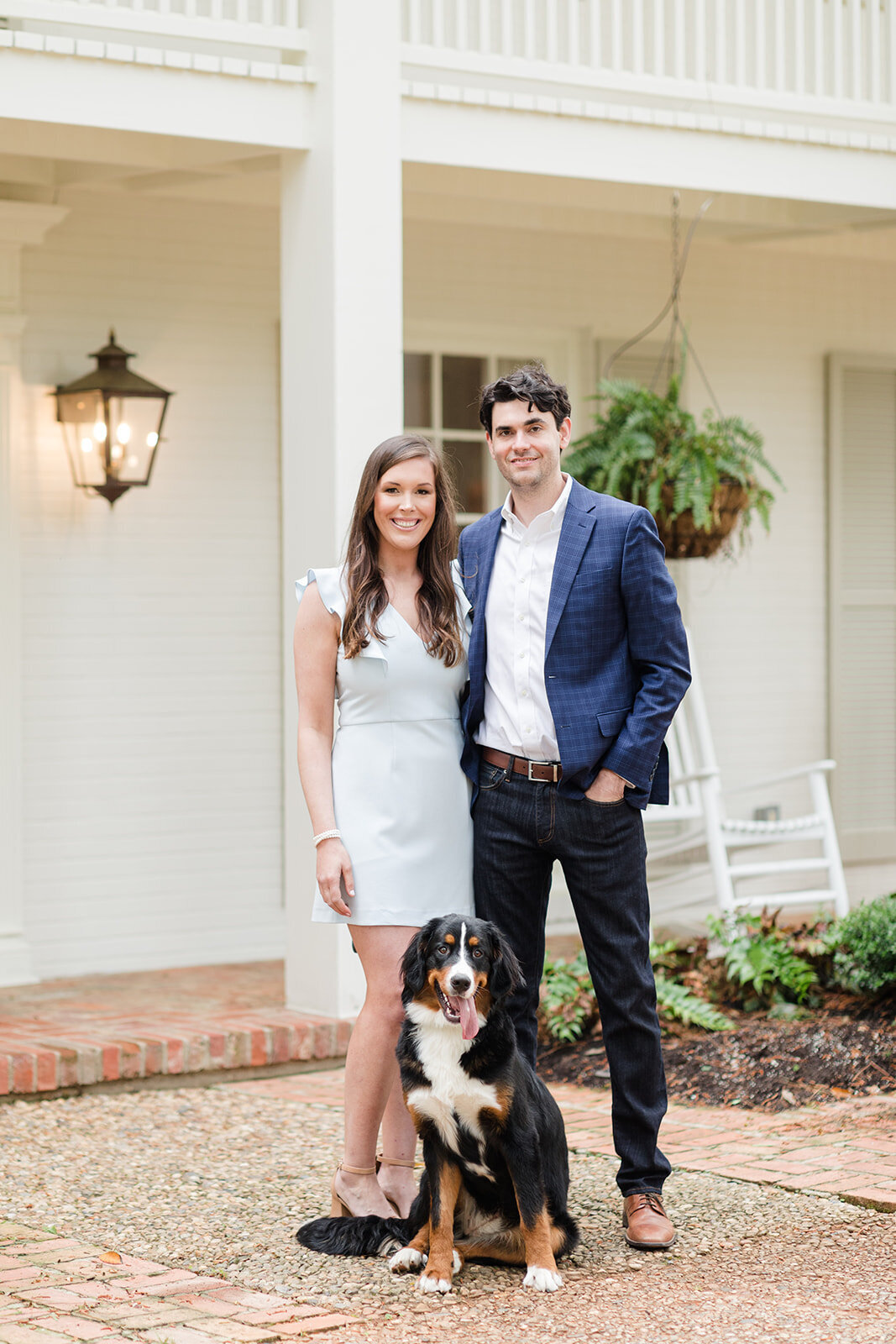Traditional engagement portrait at home with dog