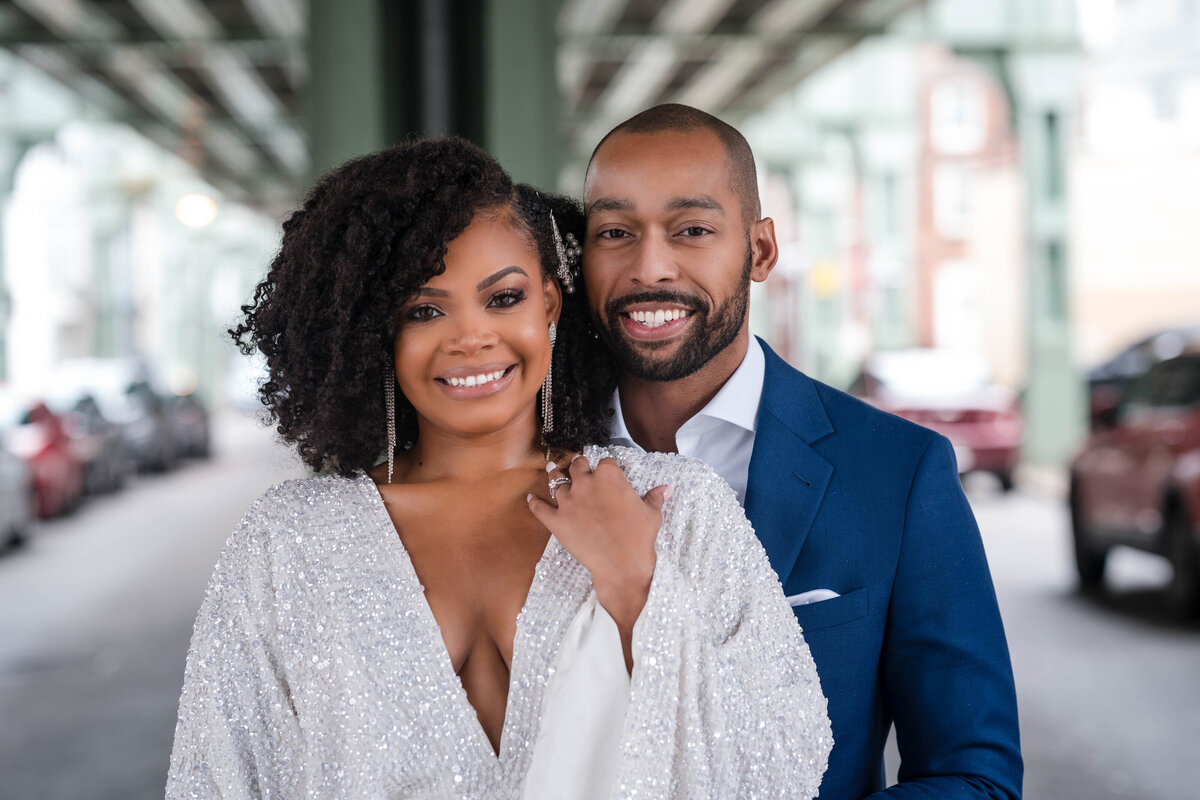 Smiling couple posing in West Philadelphia