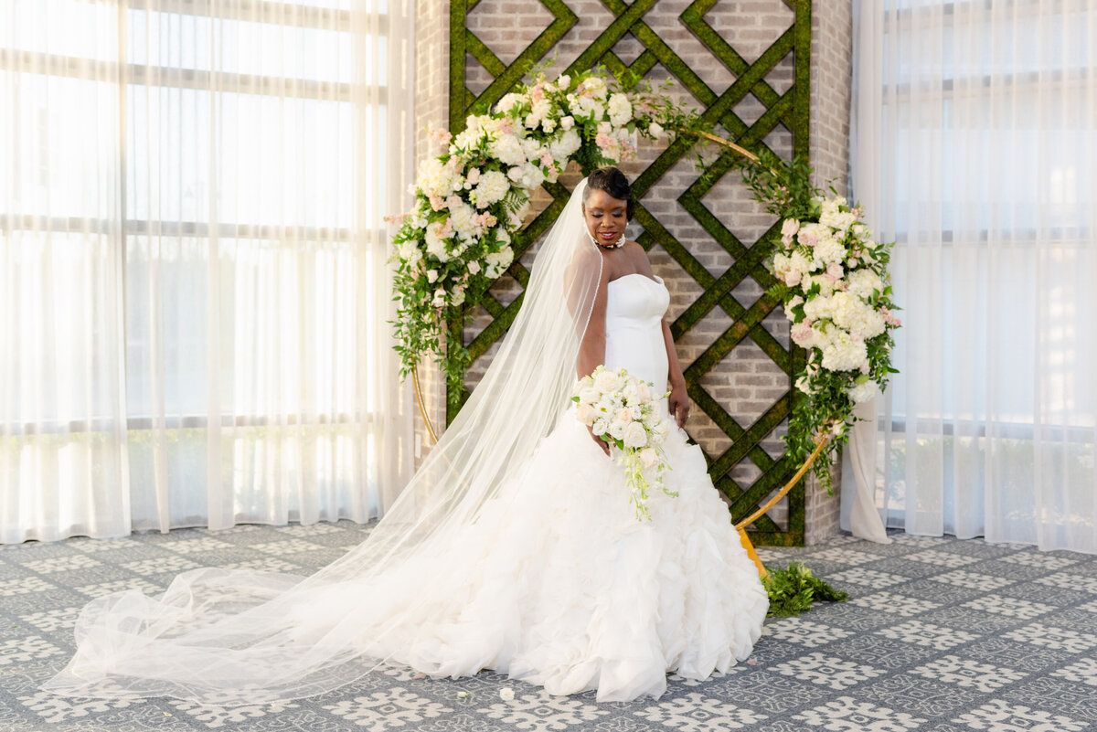 Hotel-at-Avalon-Wedding-bride-and-flower-arch