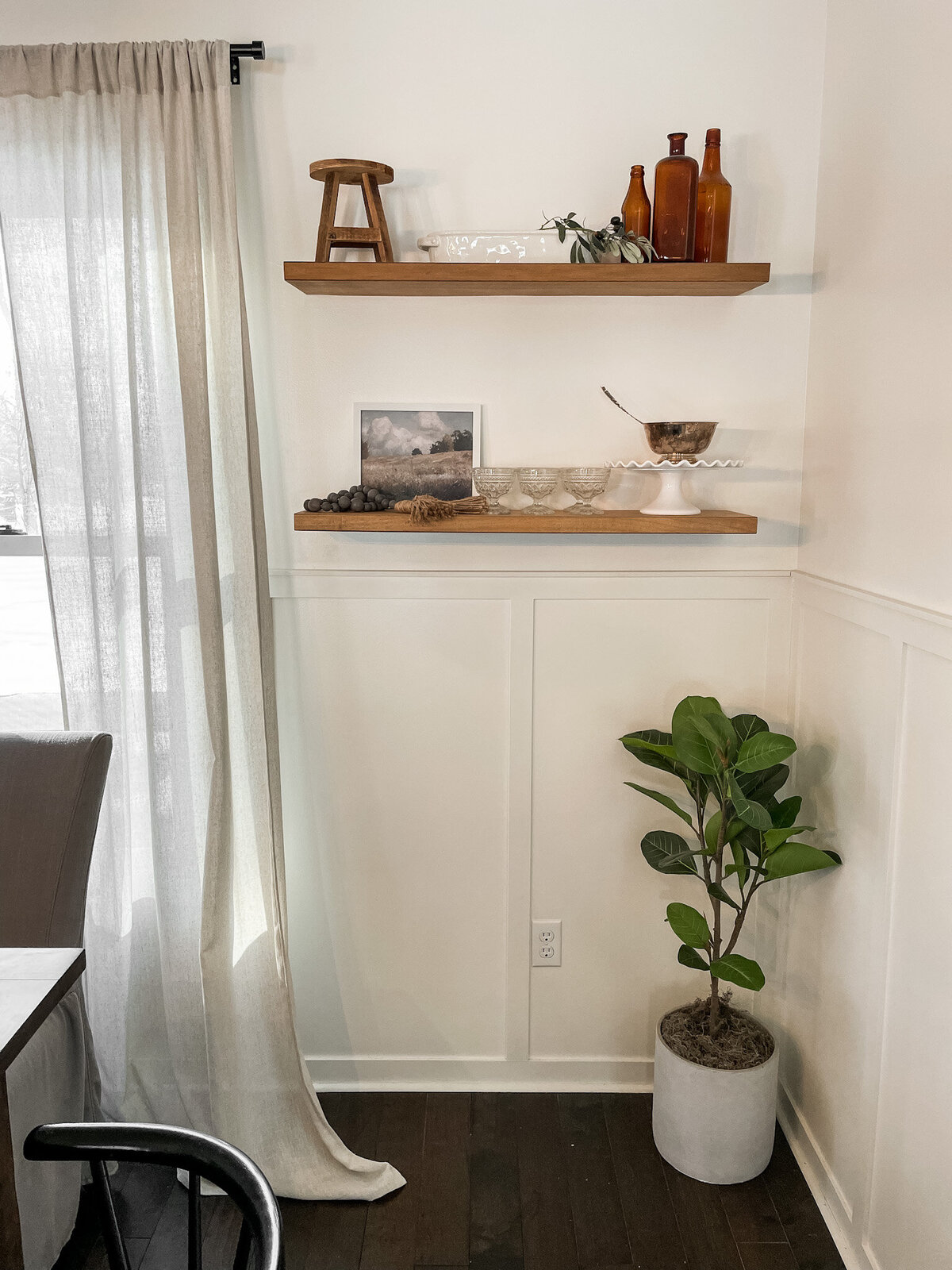 Shelf styling in dining room with vintage items