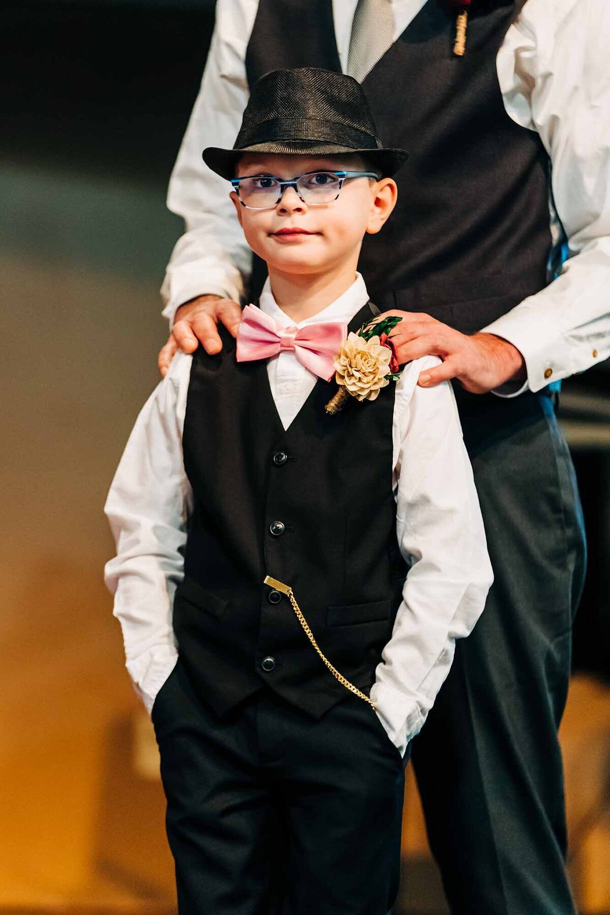 Ring bearer with pink bowtie