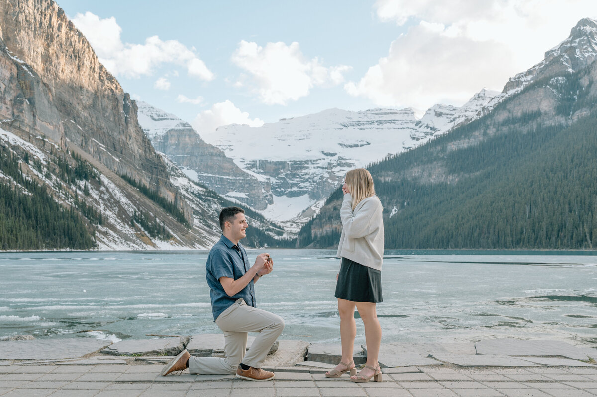 Luxury outdoor Banff wedding. Documentary photo with bride and groom drinking champagne